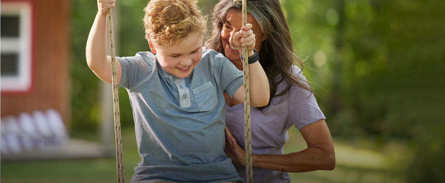 Child laughing with their mother